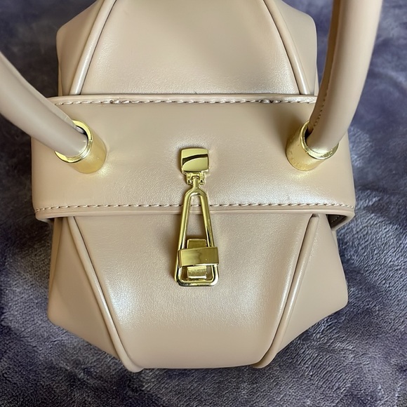 Beige small dumpling hobo bag I purchased brand new and never used. - Picture 7 of 11